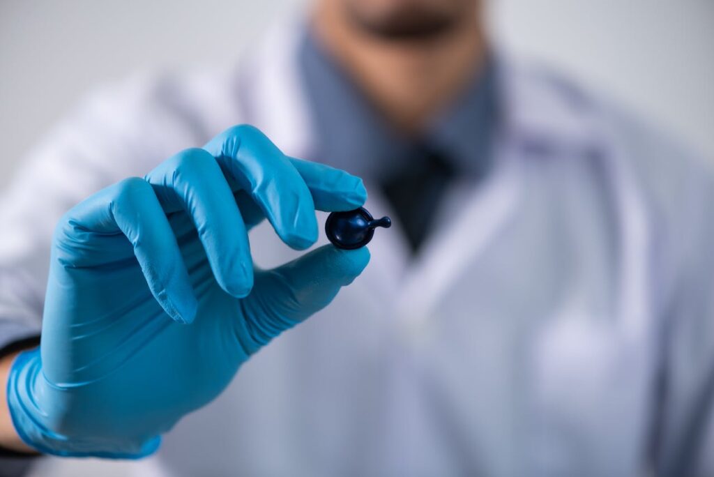 a doctor holding a pill