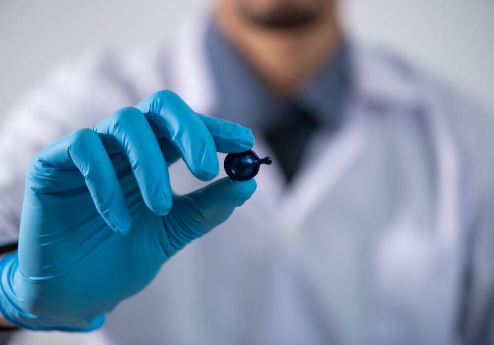 a doctor holding a pill